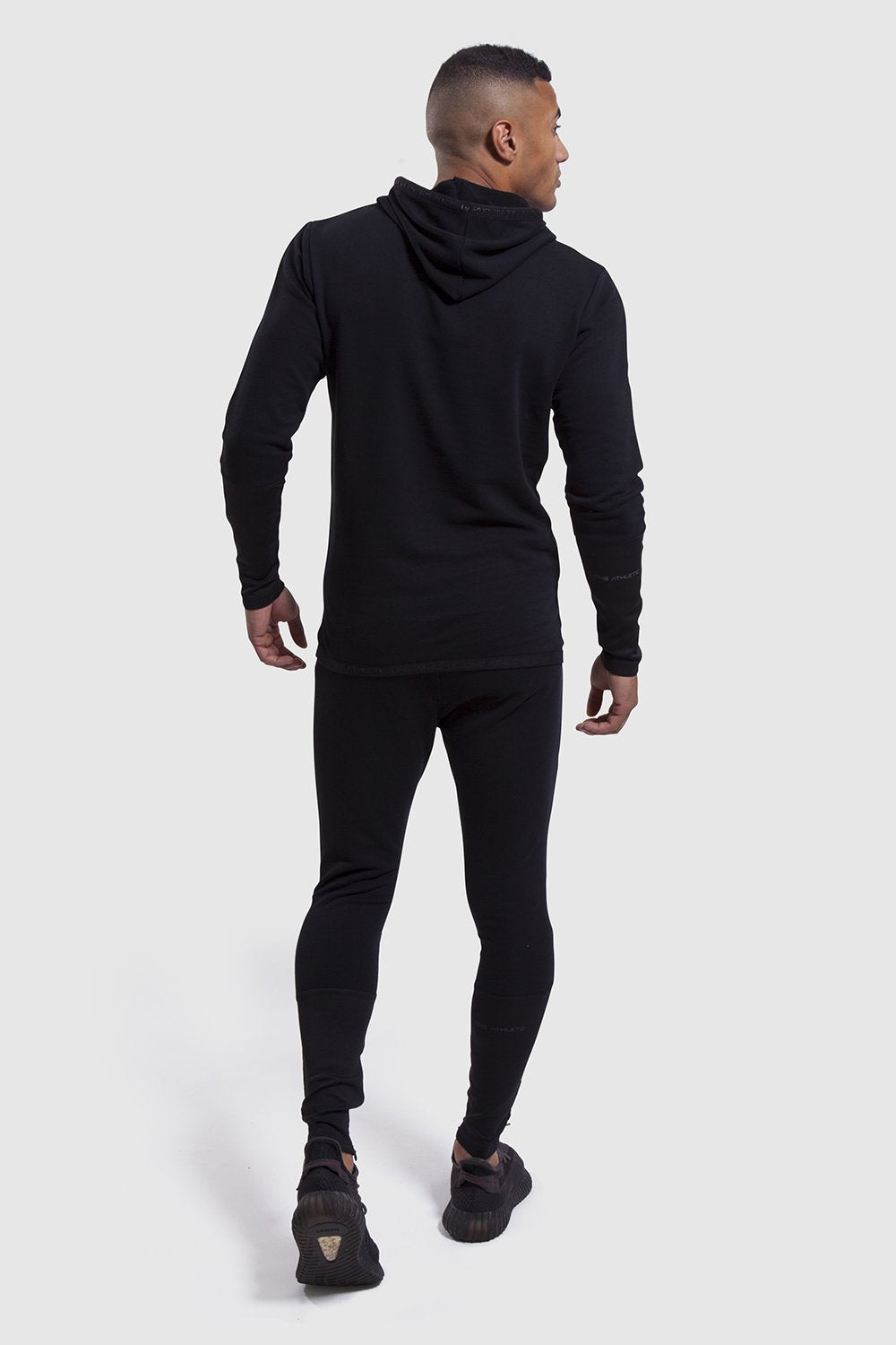 back profile of the Iverson black gym hoodie and joggers