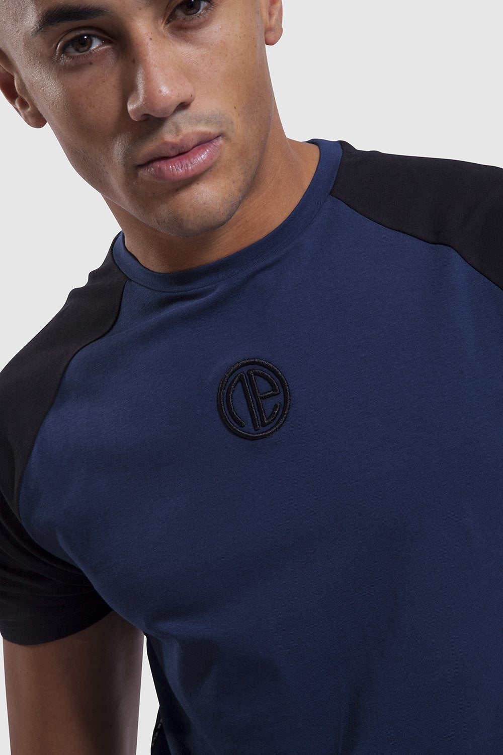 Close up on One Athletic branding on mens training top