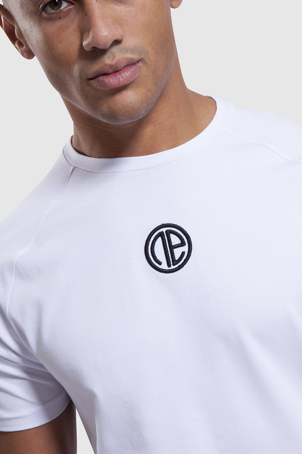 Close up of One Athletic branding on Iverson training top